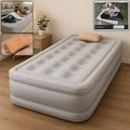 Inflatable air bed with built-in pump shown in a bedroom setting